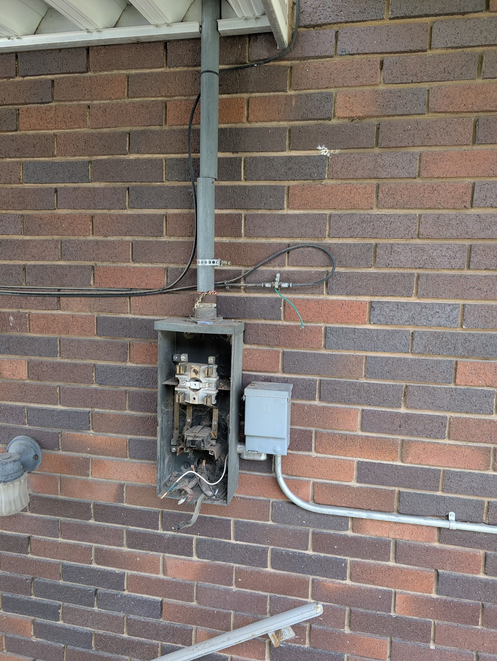 Meter Relocation, Double-Tap Fix, and Panel Upgrade on This Brick Home image